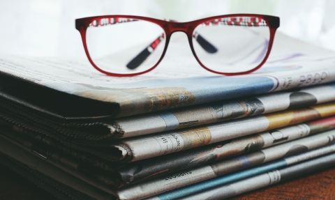 Glasses on newspaper.