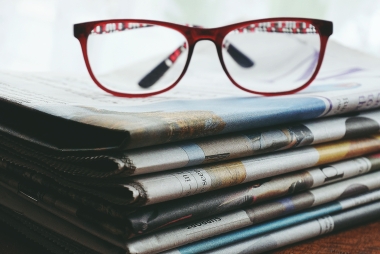 Glasses on newspaper.